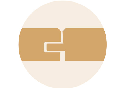 En beige och brun cirkel med ett geometriskt mönster som påminner om ett pussel i mitten.