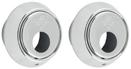 Två runda, silverfärgade cylinderbehör med präglad text på ytan.