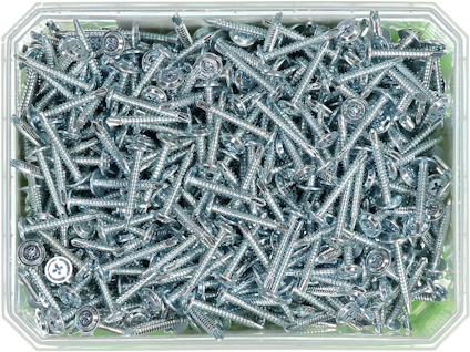 En låda fylld med många stålskruvar med stjärnformade skruvhuvuden.