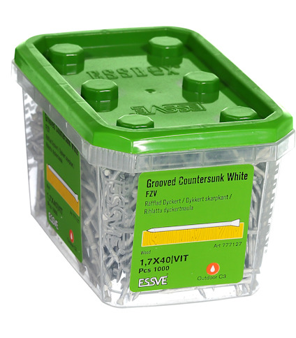 Transparent plastbehållare med grön lock, innehållande vita försänkta dyckertspikar, etiketttext: Grooved Countersunk White.